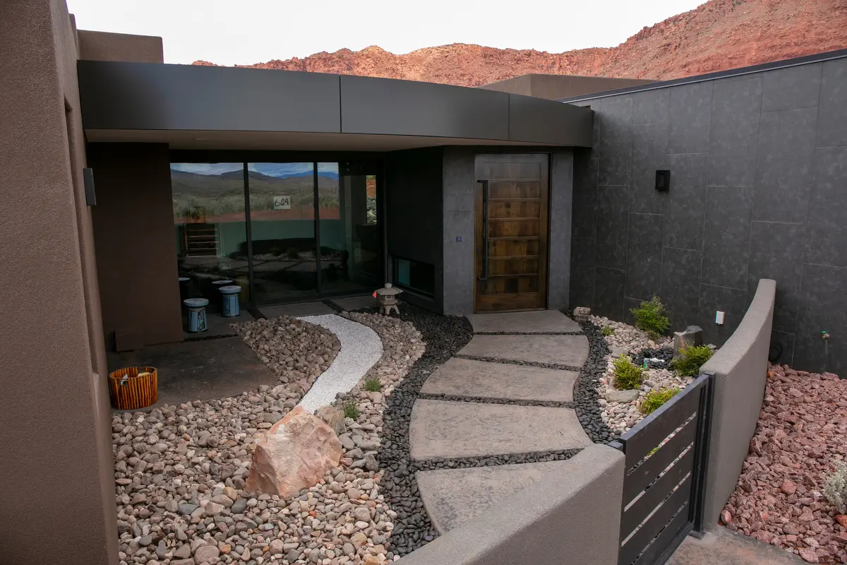 For Rich and Bonnie's landscape in Kayenta the goal was to create a zen-like atmosphere in their front courtyard and to incorporate the landscape surrounding the home into the features of their backyard.