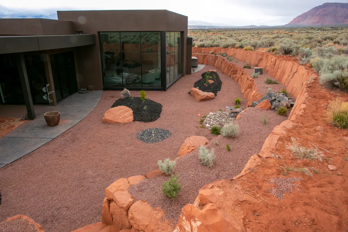 For Rich and Bonnie's landscape in Kayenta the goal was to create a zen-like atmosphere in their front courtyard and to incorporate the landscape surrounding the home into the features of their backyard.