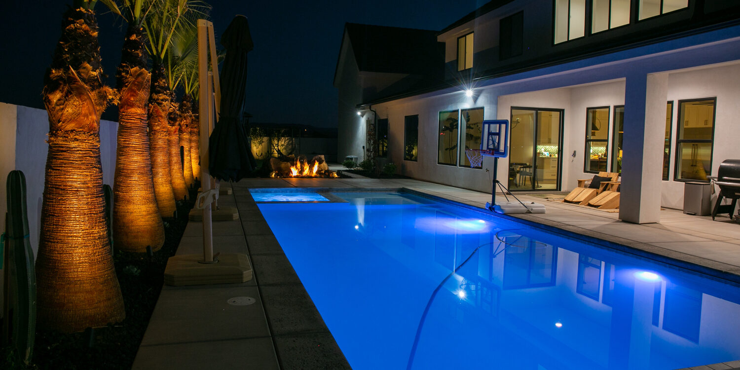 Water and Fire 001a The elements of water and fire are combined in this landscaping project in Washington, Utah. While out front, the landscape is dominated by easy-to-care-for artificial turf.